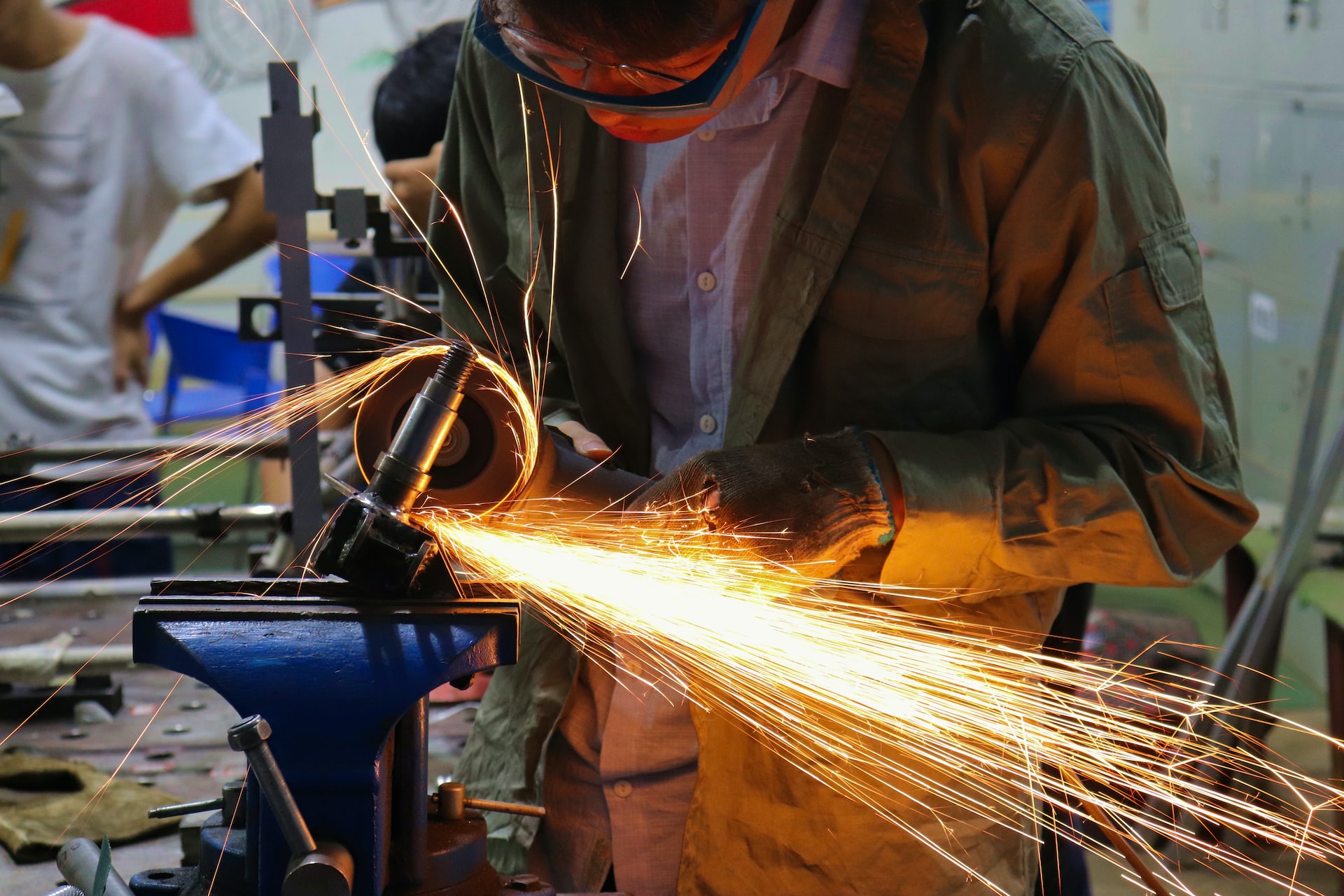 A skilled worker crafting man cutting iron
